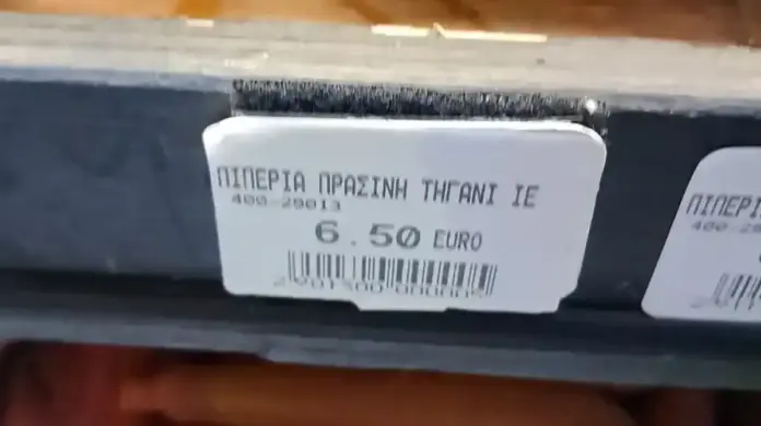 Store sign showing frying pepper price at 6.50 euros per kilo in Meteora, Polichni